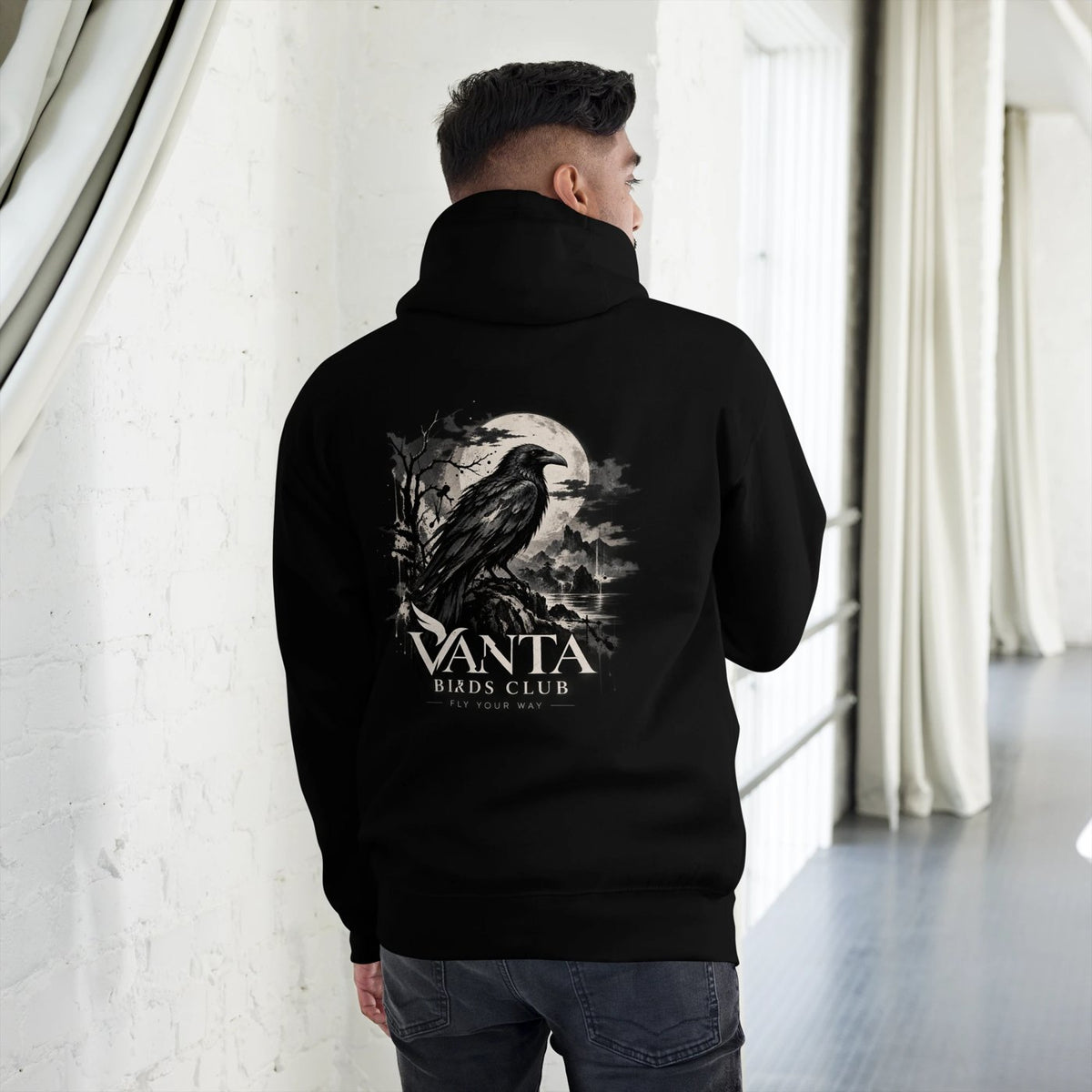 Model wearing the Raven Hoodie, raven back print